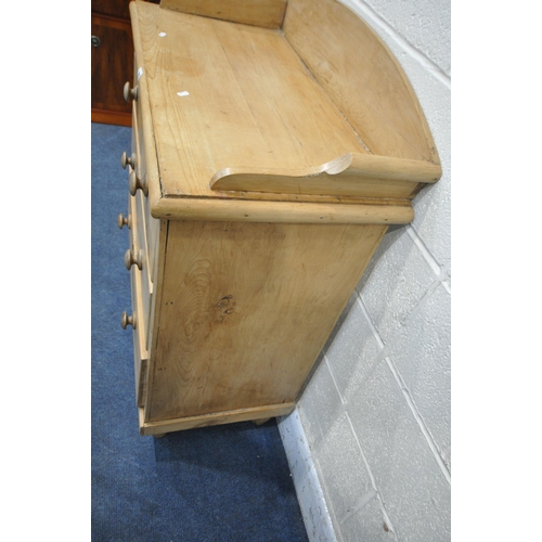 1202 - A VICTORIAN PINE WASHSTAND, with a raised back, fitted with two short over two long drawers, raised ... 