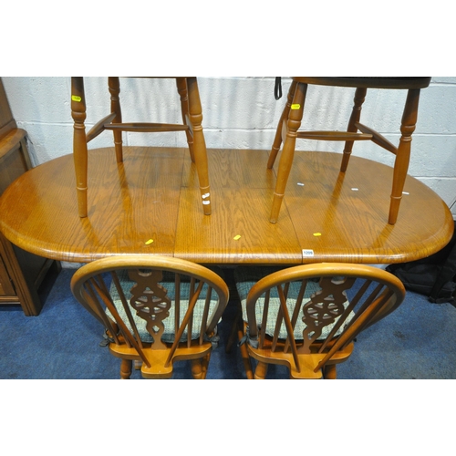 1209 - A LATE 20TH CENTURY OAK OVAL EXTENDING DINING TABLE, with one additional fold out leaf, open length ... 