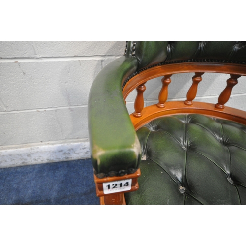 1214 - A REPRODUCTION SWIVEL OFFICE CHAIR, with buttoned green leather upholstery, raised on five shaped le... 