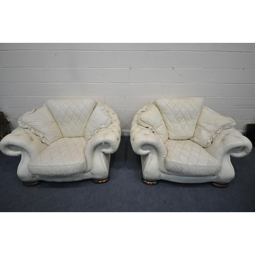 1228 - A CREAM BUTTONED LEATHER THREE PIECE LOUNGE SUITE, comprising a large two seater sofa, length 252cm ... 