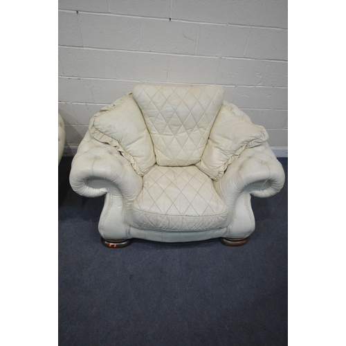 1228 - A CREAM BUTTONED LEATHER THREE PIECE LOUNGE SUITE, comprising a large two seater sofa, length 252cm ... 