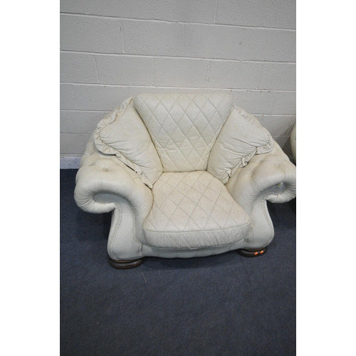 1228 - A CREAM BUTTONED LEATHER THREE PIECE LOUNGE SUITE, comprising a large two seater sofa, length 252cm ... 