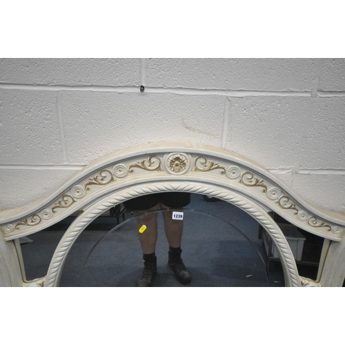 1239 - A LARGE ITALIAN CREAM OVERMANTEL MIRROR, with arched top and foliate details, width 149cm x height 1... 