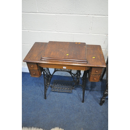 1246 - A SELECTION OF OCCASIONAL FURNITURE, to include an early 20th century oak cased Singer treadle sewin... 