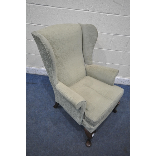 1249 - A GREEN UPHOLSTERED WINGBACK ARMCHAIR, width 75cm x depth 87cm x height 95cm (condition report: gene... 