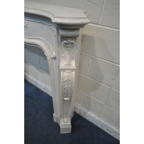 1260 - AN ITALIAN MARBLE EFFECT RESIN FIRE SURROUND, with foliate details, width 139cm x depth 27cm x heigh... 