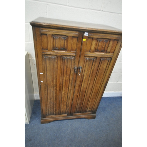 1266 - AN EARLY 20TH CENTURY OAK LINENFOLD GENTLEMAN'S WARDROBE, width 86cm x depth 47cm x height 138cm, al... 