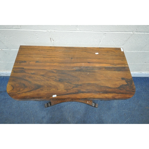 1269 - A REGENCY ROSEWOOD FOLD OVER CARD TABLE, the revolving top enclosing a green baize playing surface, ... 