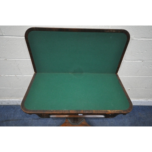 1269 - A REGENCY ROSEWOOD FOLD OVER CARD TABLE, the revolving top enclosing a green baize playing surface, ... 