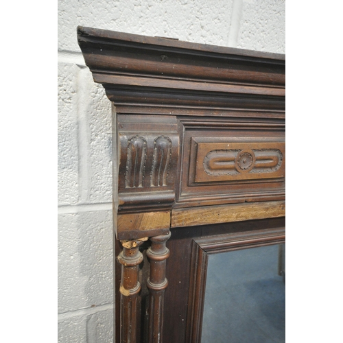 1272 - A 20TH CENTURY OAK OVERMANTEL MIRROR, with various carved details, turned and fluted supports, width... 