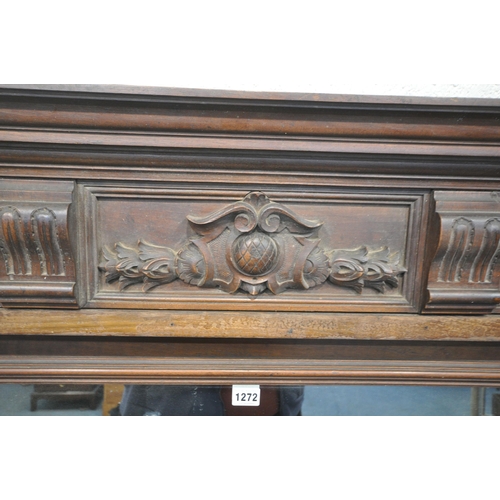 1272 - A 20TH CENTURY OAK OVERMANTEL MIRROR, with various carved details, turned and fluted supports, width... 