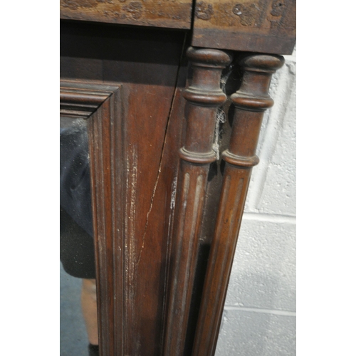 1272 - A 20TH CENTURY OAK OVERMANTEL MIRROR, with various carved details, turned and fluted supports, width... 