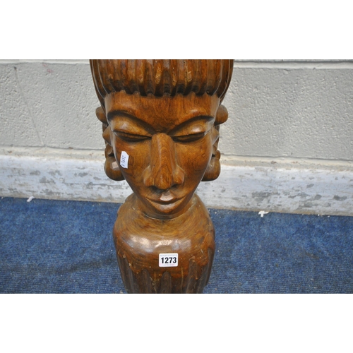 1273 - A SOLID TEAK CARVED BUST OF A WOMAN, with tall hair and piercings, height 85cm (condition report: ge... 