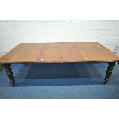 1295 - AN EDWARDIAN MAHOGANY WIND OUT DINING TABLE, with two additional leaves, raised on turned legs, exte... 