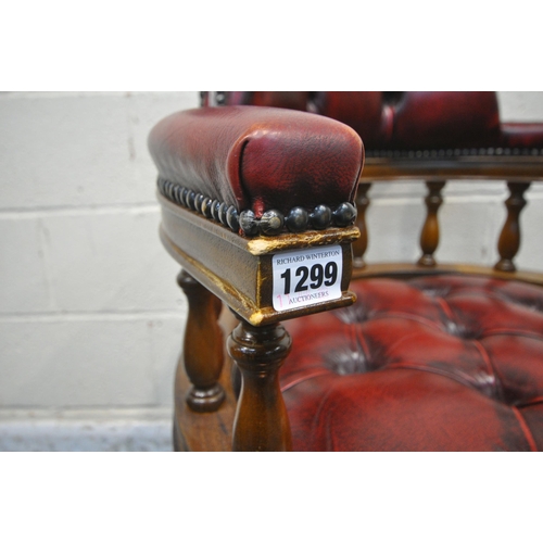 1299 - A REPRODUCTION OXBLOOD BUTTONED LEATHER BOW TOP SWIVEL OFFICE CHAIR, width 63cm x depth 62cm x heigh... 