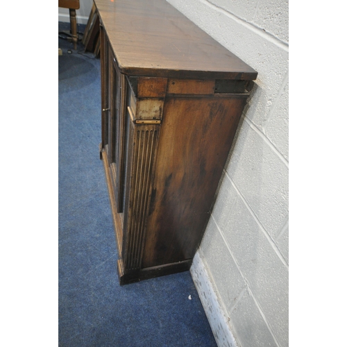 1304 - AN EARLY 20TH CENTURY MAHOGANY CABINET with a single glazed door, flanked by two glass panes, that's... 