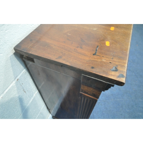 1304 - AN EARLY 20TH CENTURY MAHOGANY CABINET with a single glazed door, flanked by two glass panes, that's... 