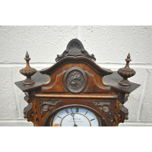 1320 - A LATE 19TH / EARLY 20TH CENTURY WALNUT WALL CLOCK, with an arched crest, flanked by twin finials, t... 