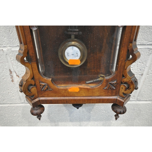 1320 - A LATE 19TH / EARLY 20TH CENTURY WALNUT WALL CLOCK, with an arched crest, flanked by twin finials, t... 