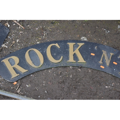 1009 - AN ARCHED METAL SIGN, READING ROCK 'N' ROLL, width 127cm, and another metal sign reading ELVIS 1935-... 