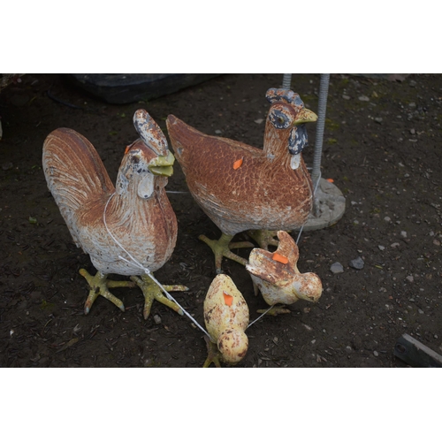 1011 - FOUR CAST IRON FIGURES, of two hens and two chicks, along with a galvanised figure of a stalk (condi... 