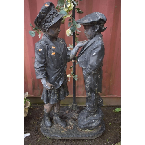 1012 - A FIGURAL GARDEN LANTERN, that's behind a boy and girl, height 178cm (condition report: finish peeli... 