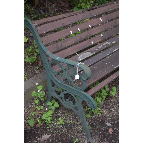 1024 - A CAST IRON GARDEN BENCH, with real slats (condition report: rickety and in need of attention)