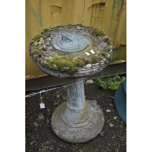 1029 - A WEATHERED COMPOSITE SUNDIAL, on a circular base, diameter 43cm x height 63cm, and a composite bird... 