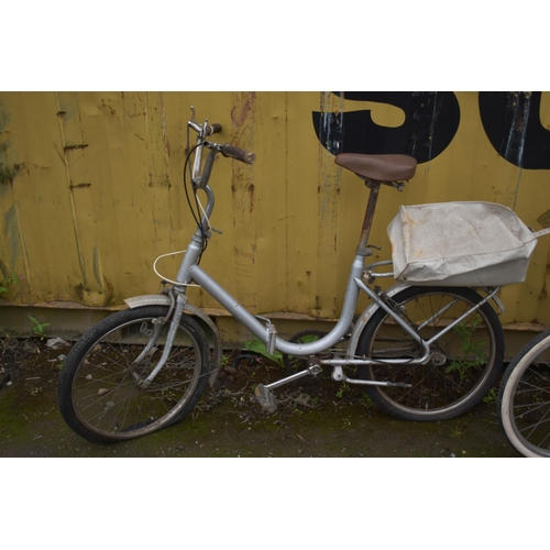 1032 - A VINTAGE FOLDING BICYCLE, along with universal folding bicycle (condition report: universal bike no... 