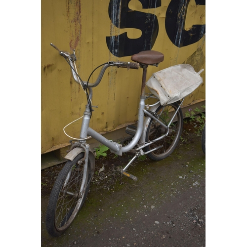 1032 - A VINTAGE FOLDING BICYCLE, along with universal folding bicycle (condition report: universal bike no... 