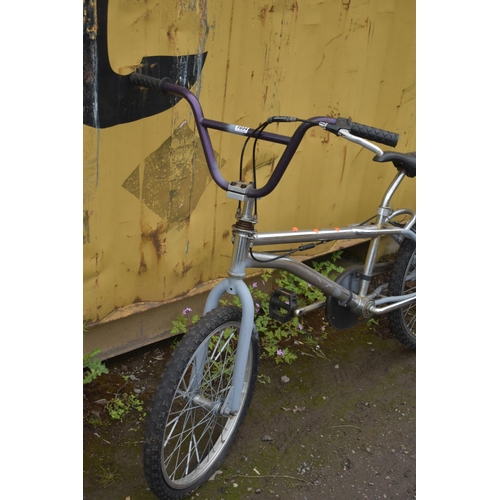 1034 - AN UNBRANDED BMX BIKE (some rusting and tyres flat)