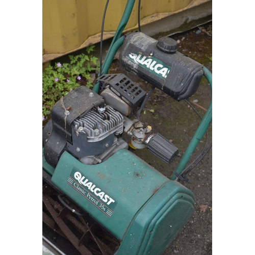 1035 - A QUALCAST CLASSIC PETROL 35s CYLINDER LAWNMOWER, with an odd grassbox and aerator (condition report... 