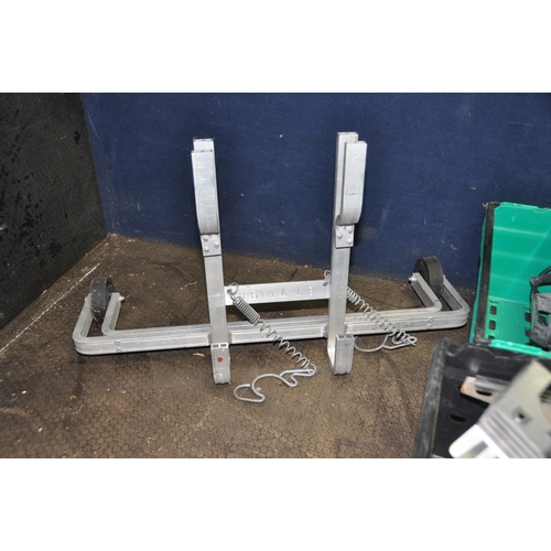 1069 - THREE TRAYS CONTAINING TOOLS including an untested Wickes tile cutter, three axle stands, a Record N... 