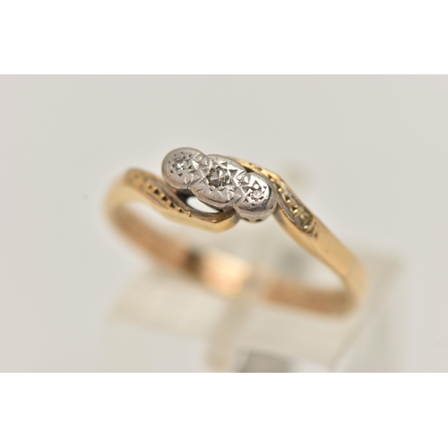 25 - A YELLOW METAL DIAMOND RING, three single cut diamonds, illusion set in a white metal mount, cross o... 