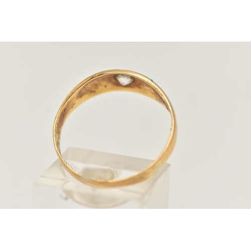 29 - A YELLOW METAL SINGLE STONE RING, star set with a colourless circular cut sapphire, to a polished ba... 