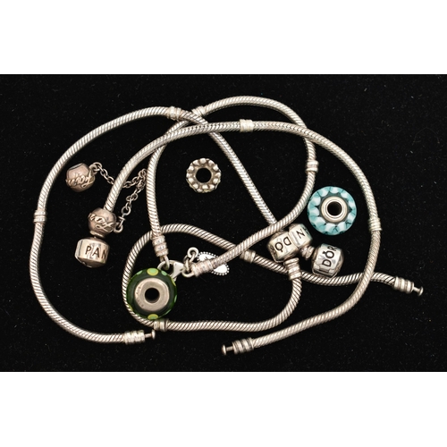 39 - FOUR PANDORA CHARM BRACELETS WITH CHARMS, to include four snake chain charm bracelets, one with spri... 