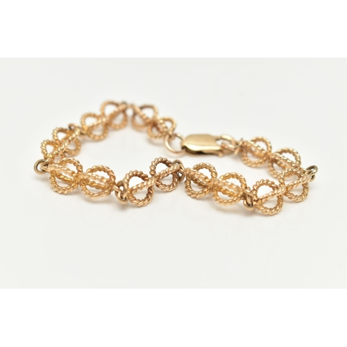 4 - A 9CT GOLD FANCY LINK BRACELET, rope twist open work links, fitted with a lobster clasp, part Sheffi... 