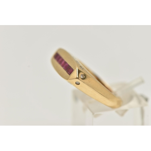 50 - A YELLOW METAL GEM SET SIGNET RING, a rectangular form signet ring, channel set with seven square cu... 