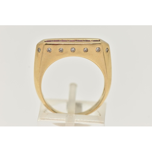 50 - A YELLOW METAL GEM SET SIGNET RING, a rectangular form signet ring, channel set with seven square cu... 