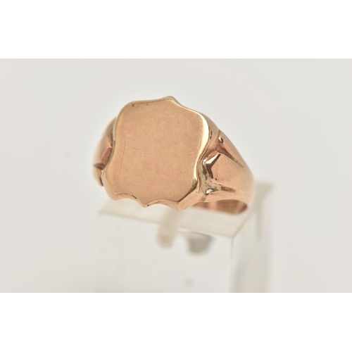 55 - A 9CT GOLD SIGNET RING, yellow gold shield design signet ring, approximate width 14mm, hallmarked 9c... 