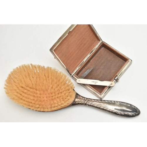 78 - THREE ITEMS OF SILVERWARE, to include a 1920's silver mounted hairbrush, hallmark for Birmingham 192... 