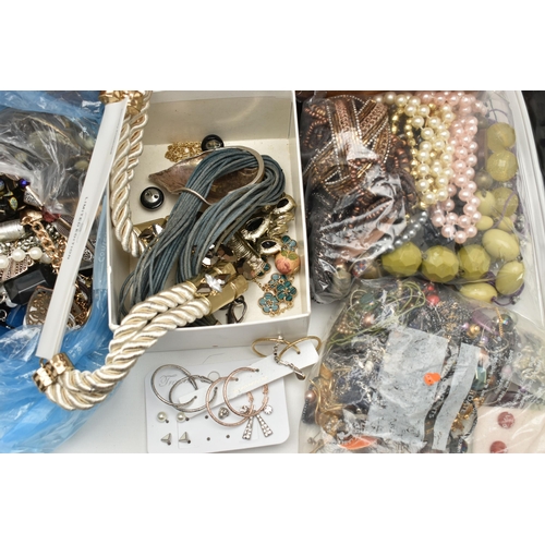 101 - A LARGE ASSORTMENT OF COSTUME JEWELLERY, to include various bags filled with beaded necklaces, imita... 