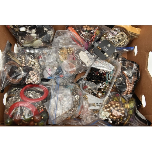 101 - A LARGE ASSORTMENT OF COSTUME JEWELLERY, to include various bags filled with beaded necklaces, imita... 