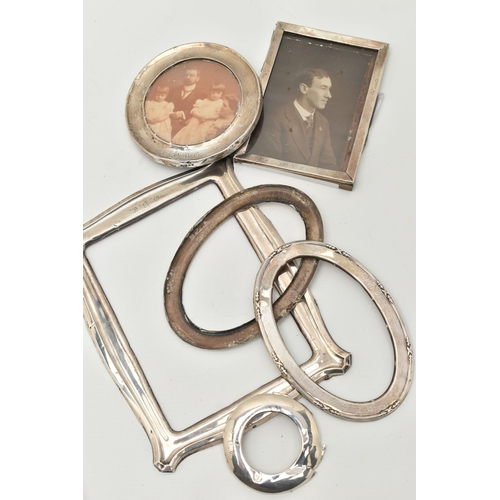 82 - SILVER PHOTO FRAMES, to include a circular photo frame hallmarked Birmingham, with photo, a rectangu... 