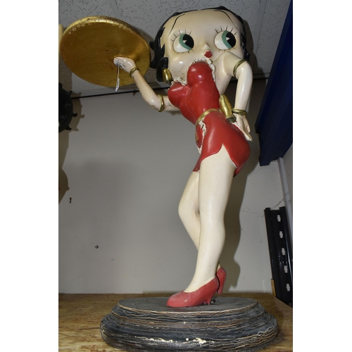 321 - A BETTY BOOP STATUE in the form of a vintage style waitress carrying a gold tray in a red dress, a l... 