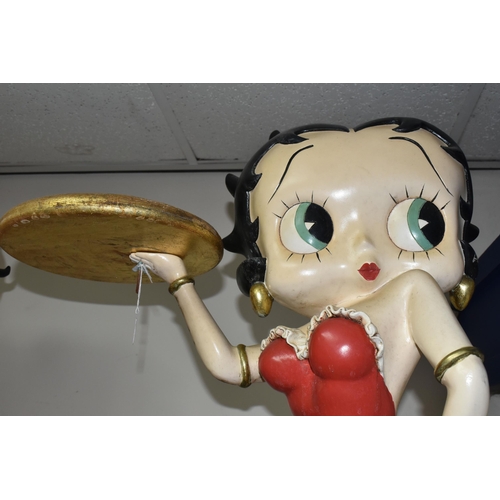 321 - A BETTY BOOP STATUE in the form of a vintage style waitress carrying a gold tray in a red dress, a l... 