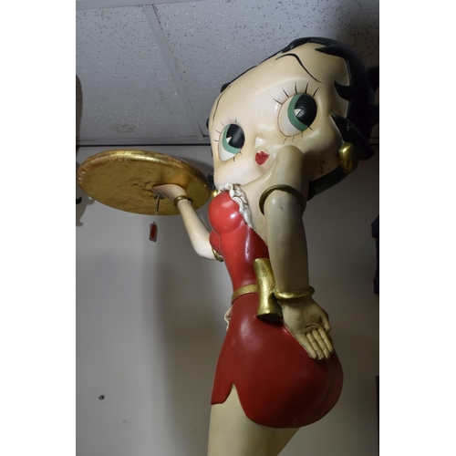 321 - A BETTY BOOP STATUE in the form of a vintage style waitress carrying a gold tray in a red dress, a l... 