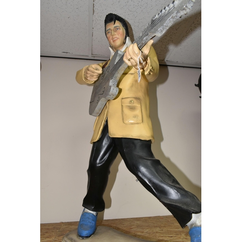 324 - AN ELVIS RESIN DISPLAY STATUE, approximately 92cm height x 66cm width at base, in characteristic pos... 