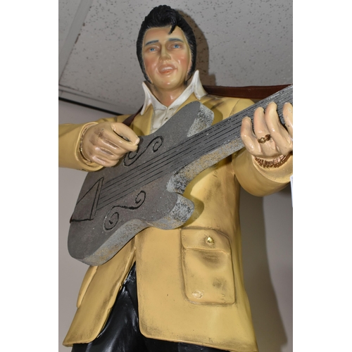 324 - AN ELVIS RESIN DISPLAY STATUE, approximately 92cm height x 66cm width at base, in characteristic pos... 