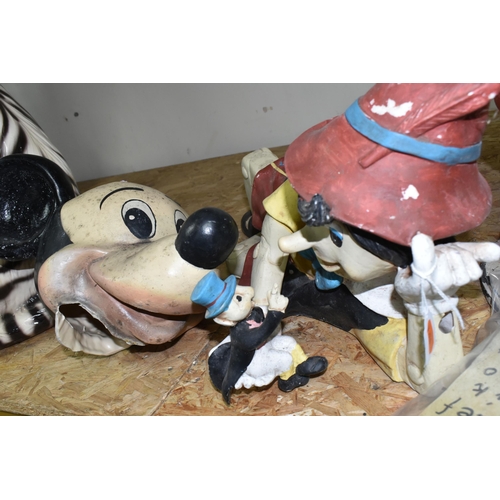 336 - THREE COMPOSITE RESIN CHILDREN'S CHARACTERS, comprising a standing Mickey Mouse, a reclining Pinocch... 